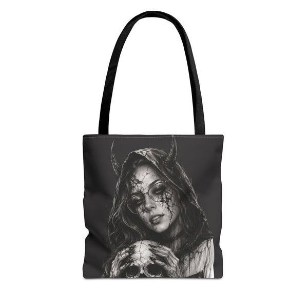 Tote bag with a black and white design of a hooded figure with horns and a skull on a white background