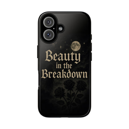 Black phone case with 'Beauty in the Breakdown' text and moon and roses design on a white background