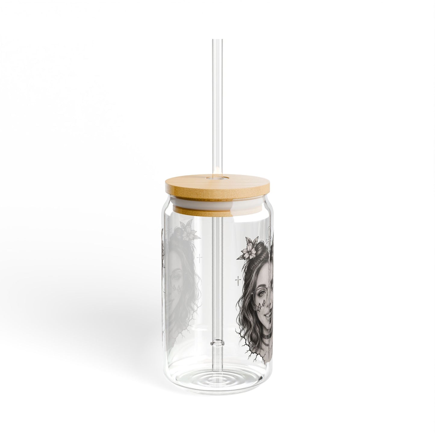 Clear glass tumbler with wooden lid and straw on a white background