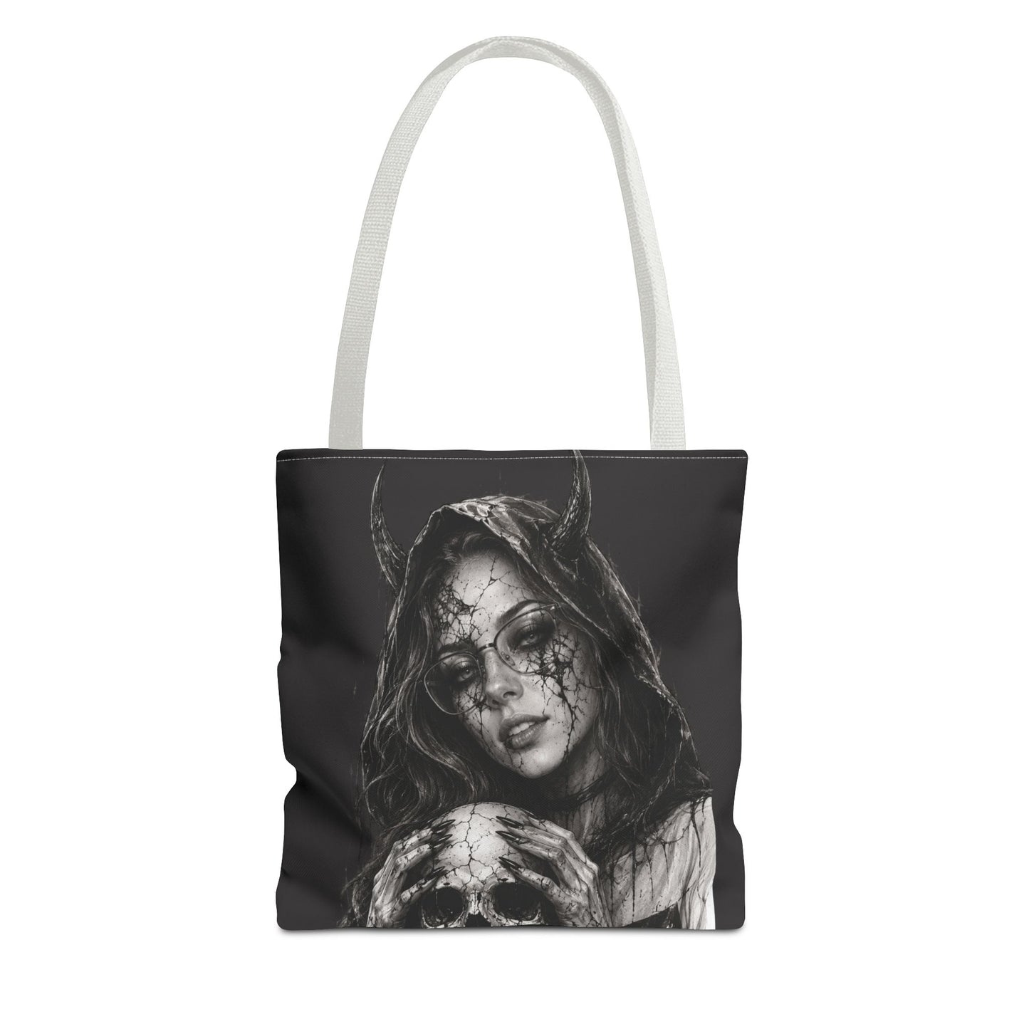 Tote bag with a black and white design of a woman with horns and a skull on a white background