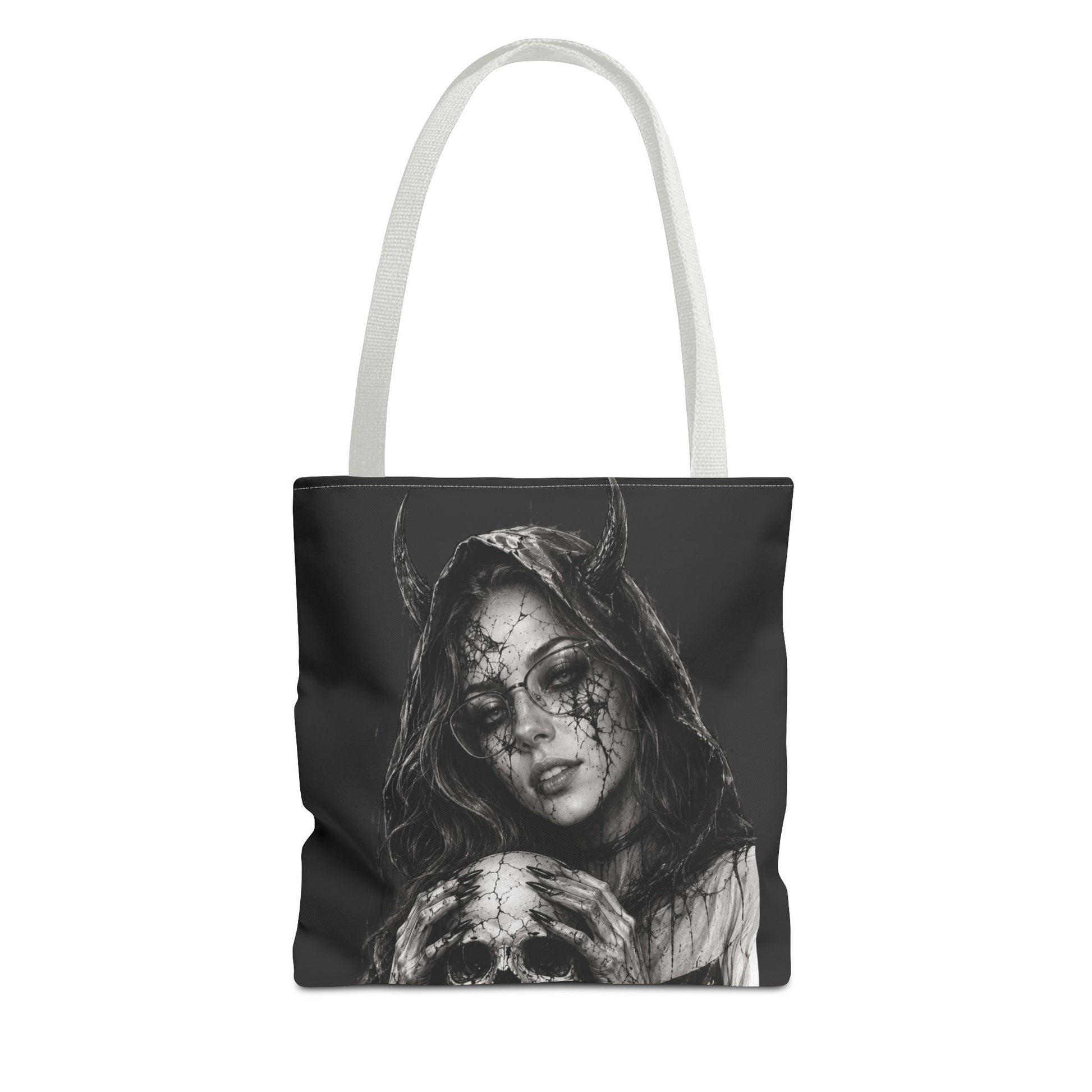Tote bag with a black and white design of a woman with horns and a skull on a white background