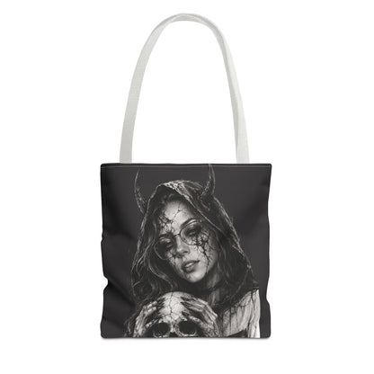 Tote bag with a black and white design of a woman with horns and a skull on a white background