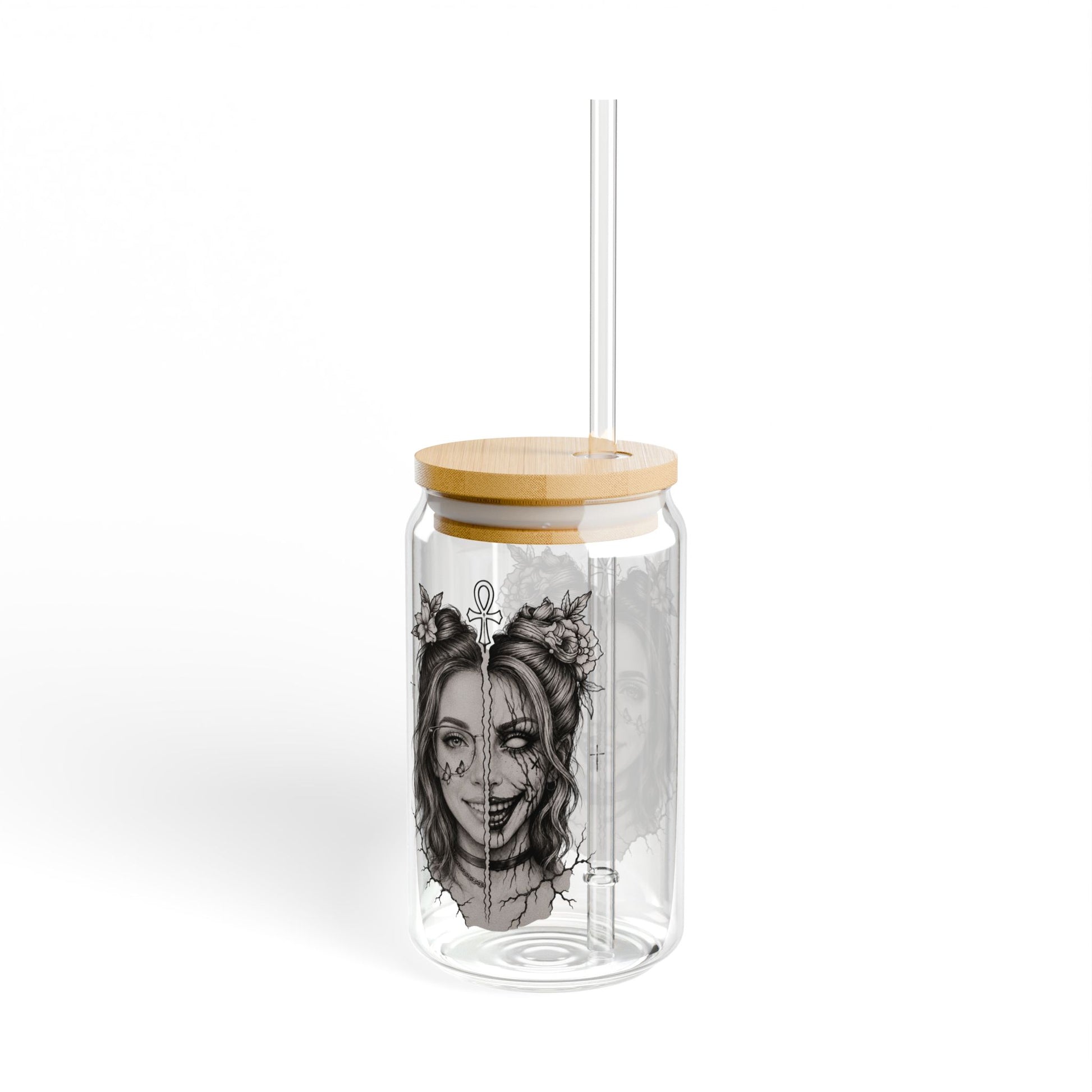 Clear glass tumbler with wooden lid and straw featuring a black and white illustration of a woman's face on a white background.