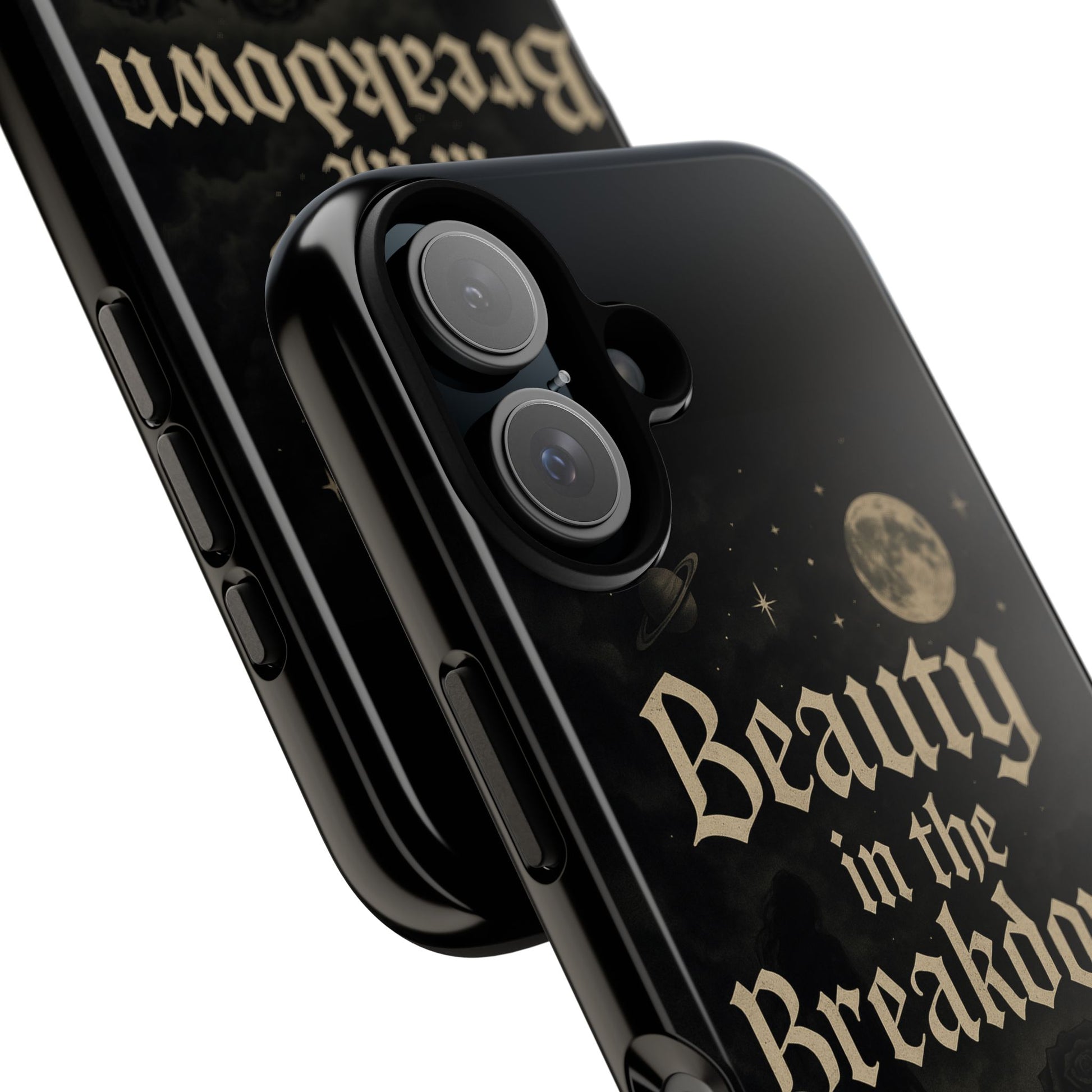 Black phone case with 'Beauty in the Breakdown' text and moon design on a white background