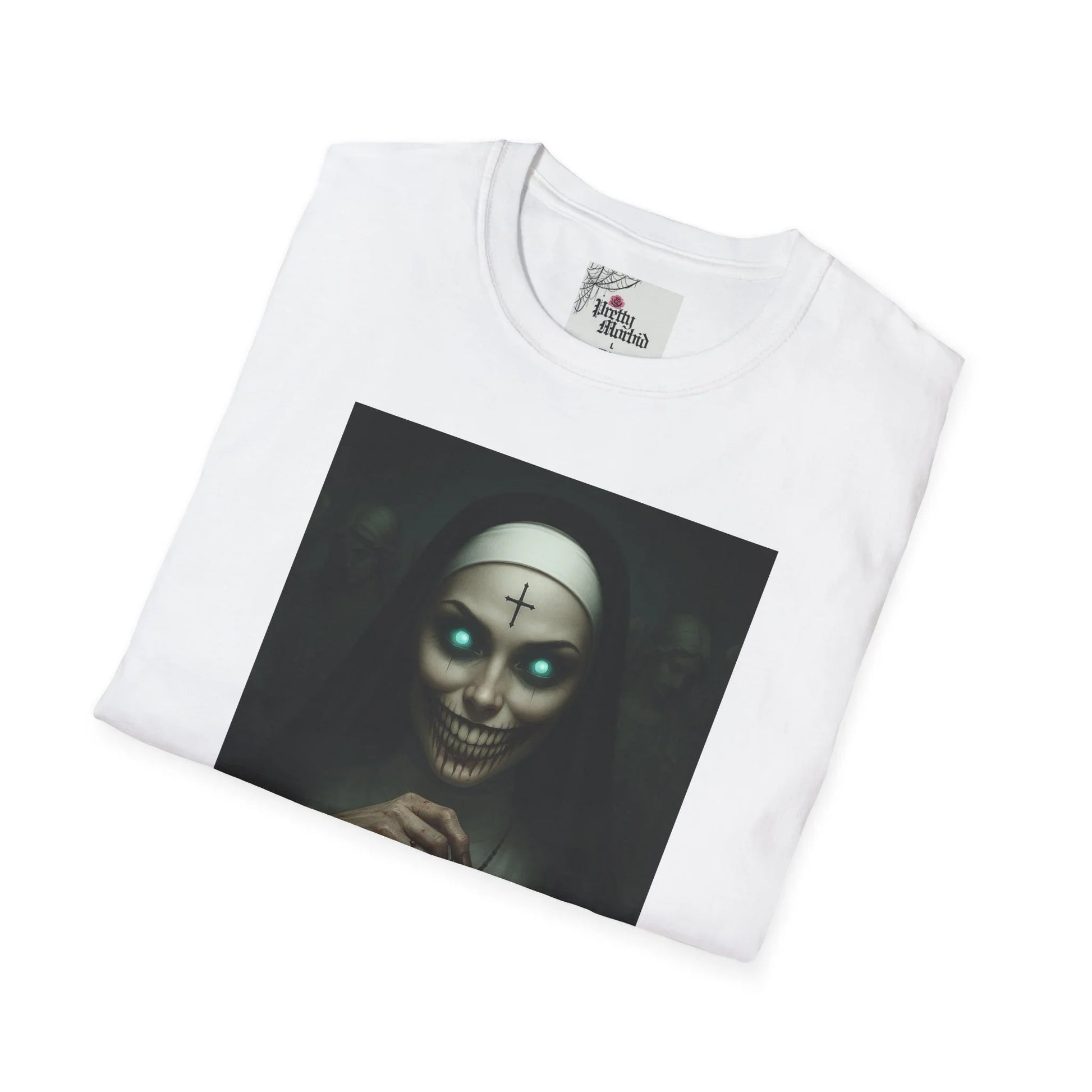 White t-shirt with eerie gothic nun graphic, glowing eyes, and cross symbol for alternative fashion