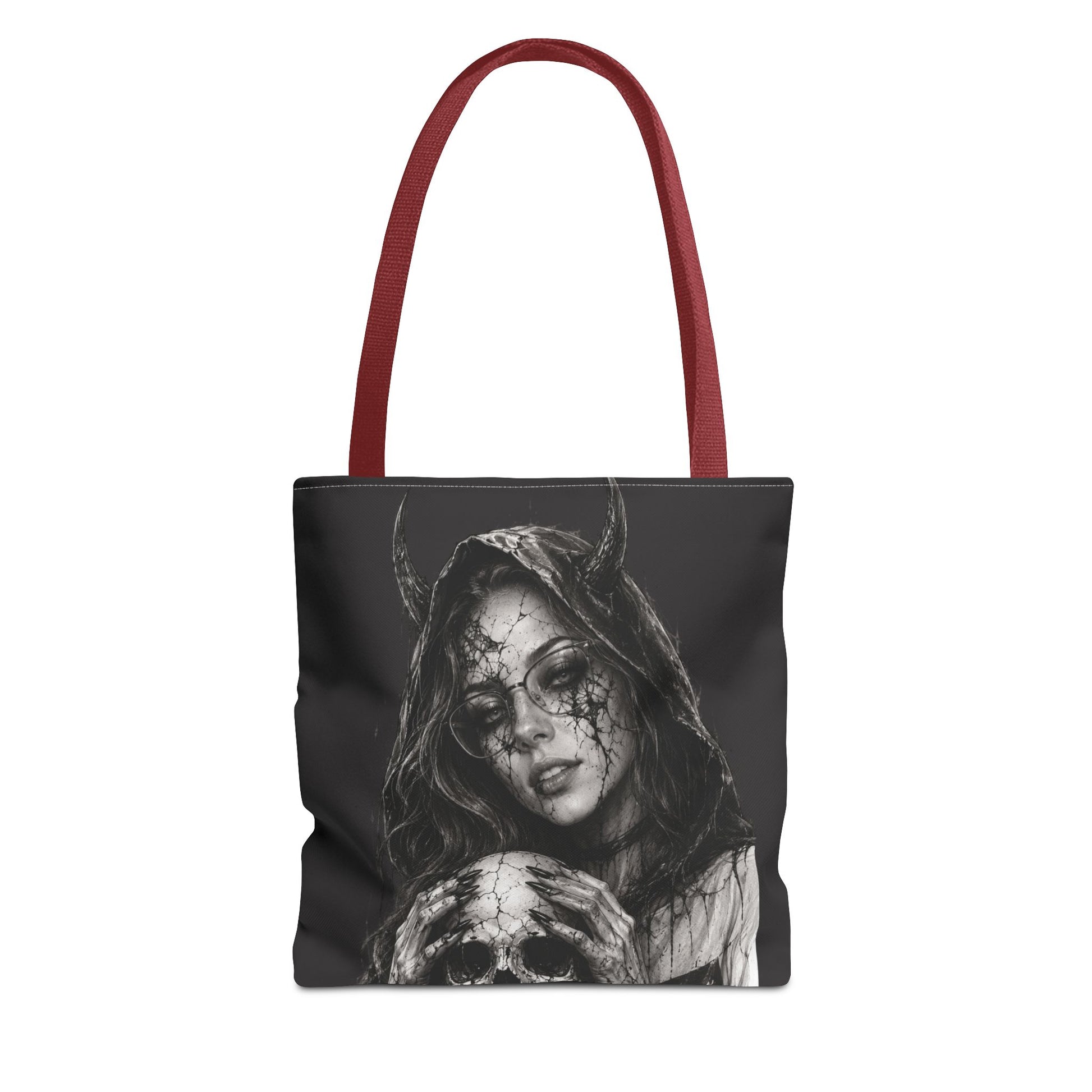 Tote bag with a design of a hooded figure holding a skull on a black background.