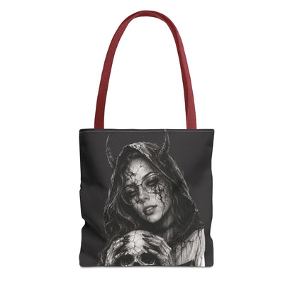 Tote bag with a design of a hooded figure holding a skull on a black background.