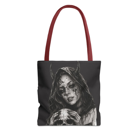 Tote bag with a design of a hooded figure holding a skull on a black background.