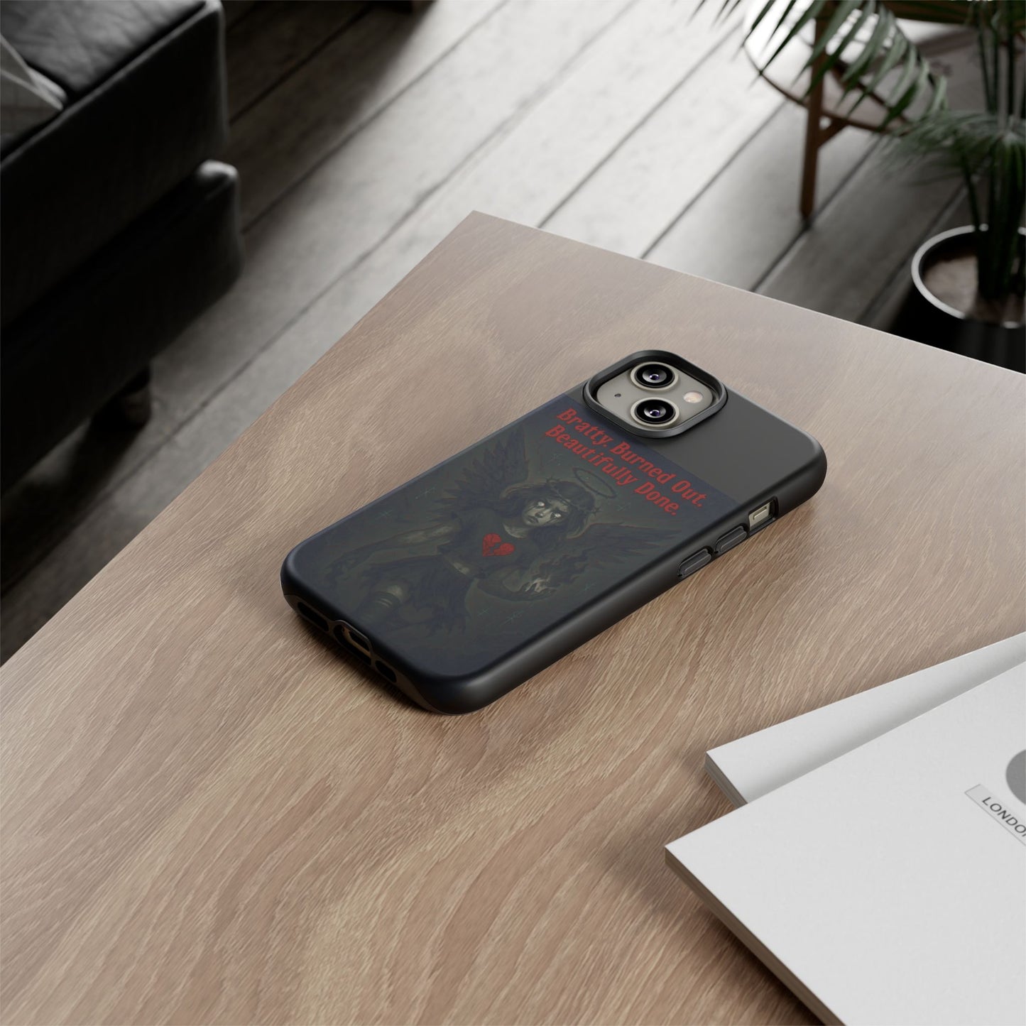 Black phone case on a wooden surface with a minimal background