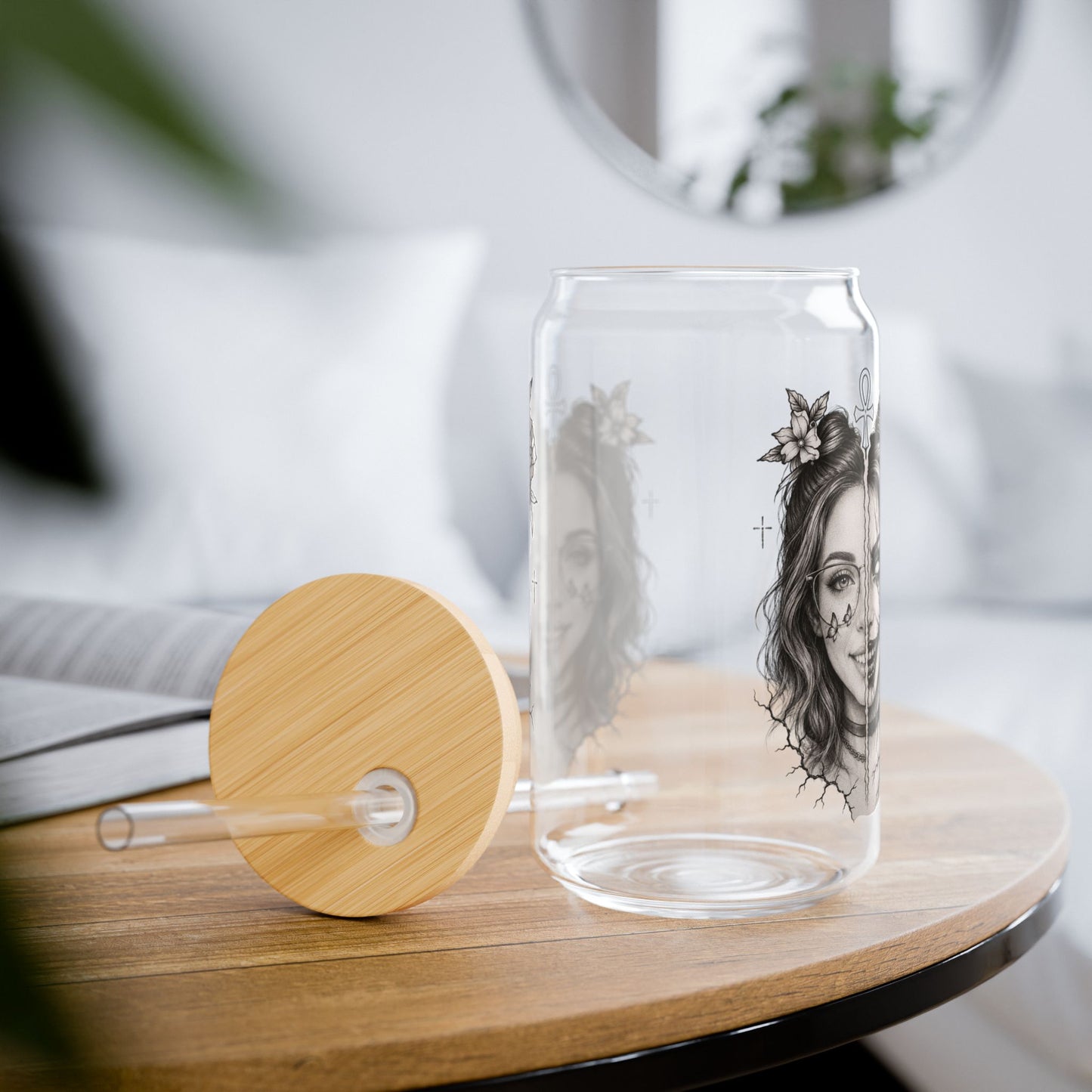 Clear glass carafe with wooden lid and artistic design on a table