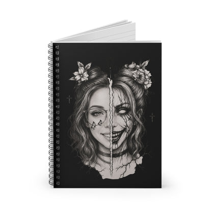 Spiral-bound notebook with a black and white illustration of a face on the cover